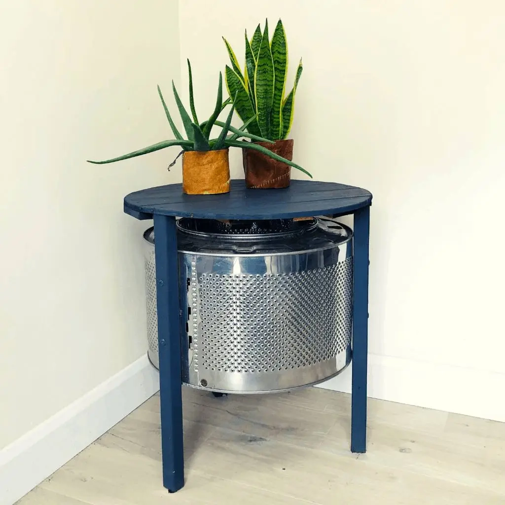 Looking for an innovative way to upcycle a washing machine?? Make yourself a washing machine drum coffee table, with some scrap wood and paint. #washingmachinedrum #DIYcoffeetable